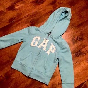 A light blue GAP jacket